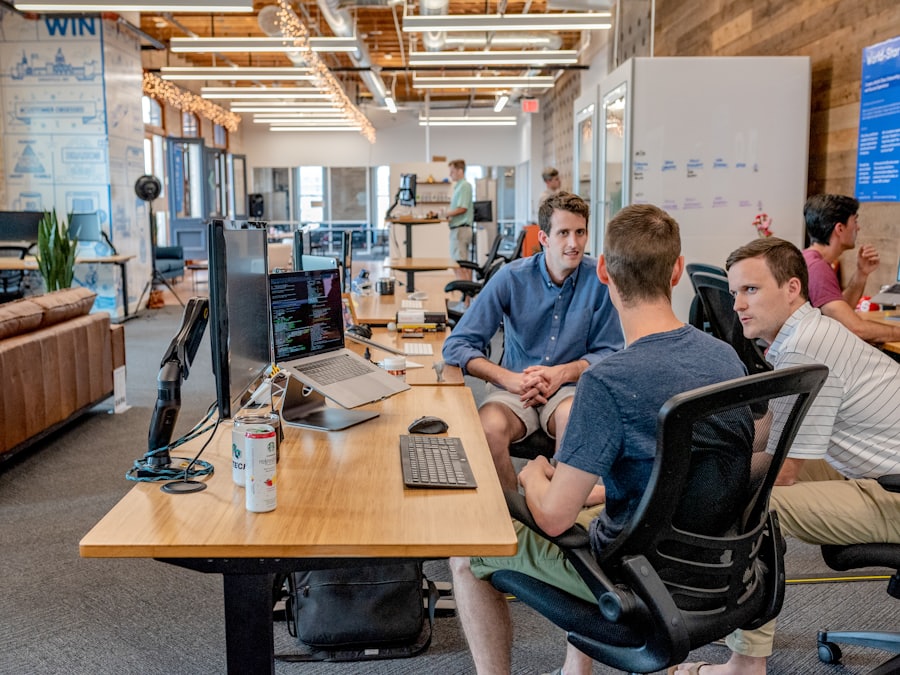 Engineering team working together at a shared desk